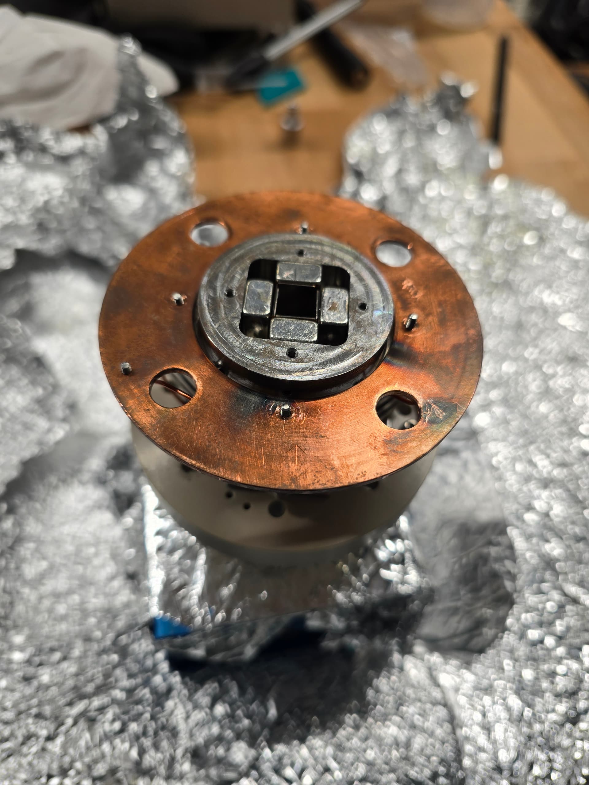 Spectrometer hardware on the bench in Kassel, wrapped in aluminium foil